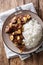 spicy beef salpicao with garlic and rice closeup on a table. Vertical top view