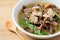 Spicy brown jelly mushroom soup with pork in a bowl