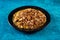 Spicy Chana chat masala chotpoti in a black dish isolated on background top view of indian, bangali and pakistani food chat pata