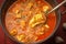Spicy chicken curry Muslim style on a vibrant red background
