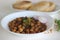 Spicy chickpea gravy with fried Indian flat bread. Locally known as Chole puri