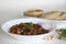 Spicy chickpea gravy with fried Indian flat bread. Locally known as Chole puri