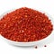 spicy chili red pepper flakes, chopped, milled dry paprika pile on white