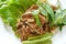 Spicy chop pork and liver salad eat couple with fresh vegetable on plate