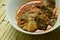 Spicy climbing perch fish dried red curry paste with basil on bowl