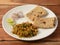 Spicy Egg bhurji or anda bhurji with Chapati, Scrambled egg with Indian flat bread, Protein rich breakfast food. served over a