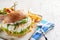 Spicy fish burger with rocket and mayonnaise