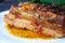 Spicy fried brisket with interlayers of pork lard, baked with herbs and spices