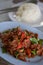 Spicy fried deer Thailand food on blue plate