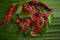 Spicy Fried dried chili prawns served on a banana leaf