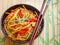 Spicy glass noodles with vegetables - carrots, cucumber, peppers, garlic. Dish Asian and Oriental cuisine