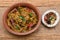 Spicy Indian chicken curry of Chettinad in clay pot