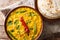 Spicy Indian thick soup Dal Tadka is a popular North Indian recipe close up in a bowl. horizontal top view