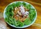 Spicy instant noodle with fish canned salad in plate