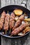 Spicy kefta kebab on skewers, vertical orientation