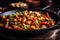 Spicy Kung Pao Chicken served in a sizzling wok with vibrant red peppers, green onions, and crushed peanuts sprinkled on top