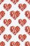 Spicy love concept with pattern from red hot chili peppers arranged into heart shapes of different sizes on a white background.