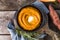 Spicy mashed sweet potato or sweet potato puree with rosemary in a saucepan on a table.  top view from above