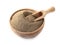 Spicy milled black pepper in wooden bowl with scoop isolated
