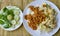 Spicy minced pork yellow curry paste and stir fried cabbage with egg on rice