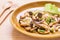 Spicy mushroom salad on plate, Thai food
