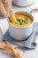 Spicy pumpkin cream soup in mug