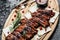 Spicy rack of spare ribs with BBQ sauce served on wood chopping board, Restaurant menu, dieting, cookbook recipe top view