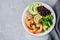 Spicy Shrimp Burrito Buddha Bowl with wild rice, broccoli, black beans and avocado