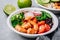 Spicy Shrimp Burrito Buddha Bowl with wild rice, spinach, radish, tomatoes, black beans and broccoli