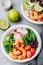 Spicy Shrimp Burrito Buddha Bowl with wild rice, spinach, radish, tomatoes, black beans and broccoli