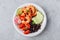 Spicy Shrimp Burrito Buddha Bowl with wild rice, tomatoes and radish, black beans and avocado