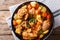 Spicy stewed chicken with vegetables close-up in a bowl. Horizon