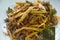 Spicy stir fried bamboo shoot and chop beef meat with basil leaf on plate