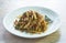 Spicy stir fried bamboo shoot and chop beef meat with basil leaf on plate