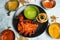 Spicy tandoori chicken Lal Badsha with chili sauce served in a dish isolated on grey background top view of bangladesh food