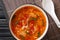 Spicy tasty tomato egg drops soup close-up in a bowl. horizontal top view
