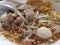 Spicy thai egg noodle with pork and fishball