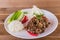 Spicy Thai minced beef salad with sticky rice