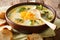 Spicy thick creamy broccoli cheese soup in a bowl with toast close-up. horizontal