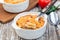 Spicy tomato jalapeno mac and cheese with mini penne pasta, in baking dish, closeup, horizontal