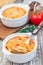 Spicy tomato jalapeno mac and cheese with mini penne pasta, in a baking dish, closeup, vertical