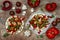 Spicy veggies tacos with roasted cauliflower, zucchini and tomato salsa on rustic wooden cutting board.