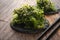 Spicy wakame salad on wooden background