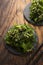 Spicy wakame salad on wooden background