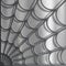 Spider web pattern on a textured metallic background