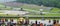 Spielberg Austrian Moto GP Moto 2 class. Blurred Crowd with a moto 2 bike and Red Bull Ring GP track in background.