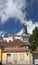 Spike of St Olaf Oleviste Church and ancient houses. Tallinn, Estonia