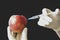 Spiking Fruits with Chemicals to Boost Sales. Foul Practice of Injecting Chemicals into Apple Fruit. Laboratory research, fruit