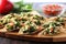 spinach and artichoke bruschetta neatly organized on a glass serving platter