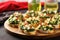 spinach and artichoke bruschetta neatly organized on a glass serving platter